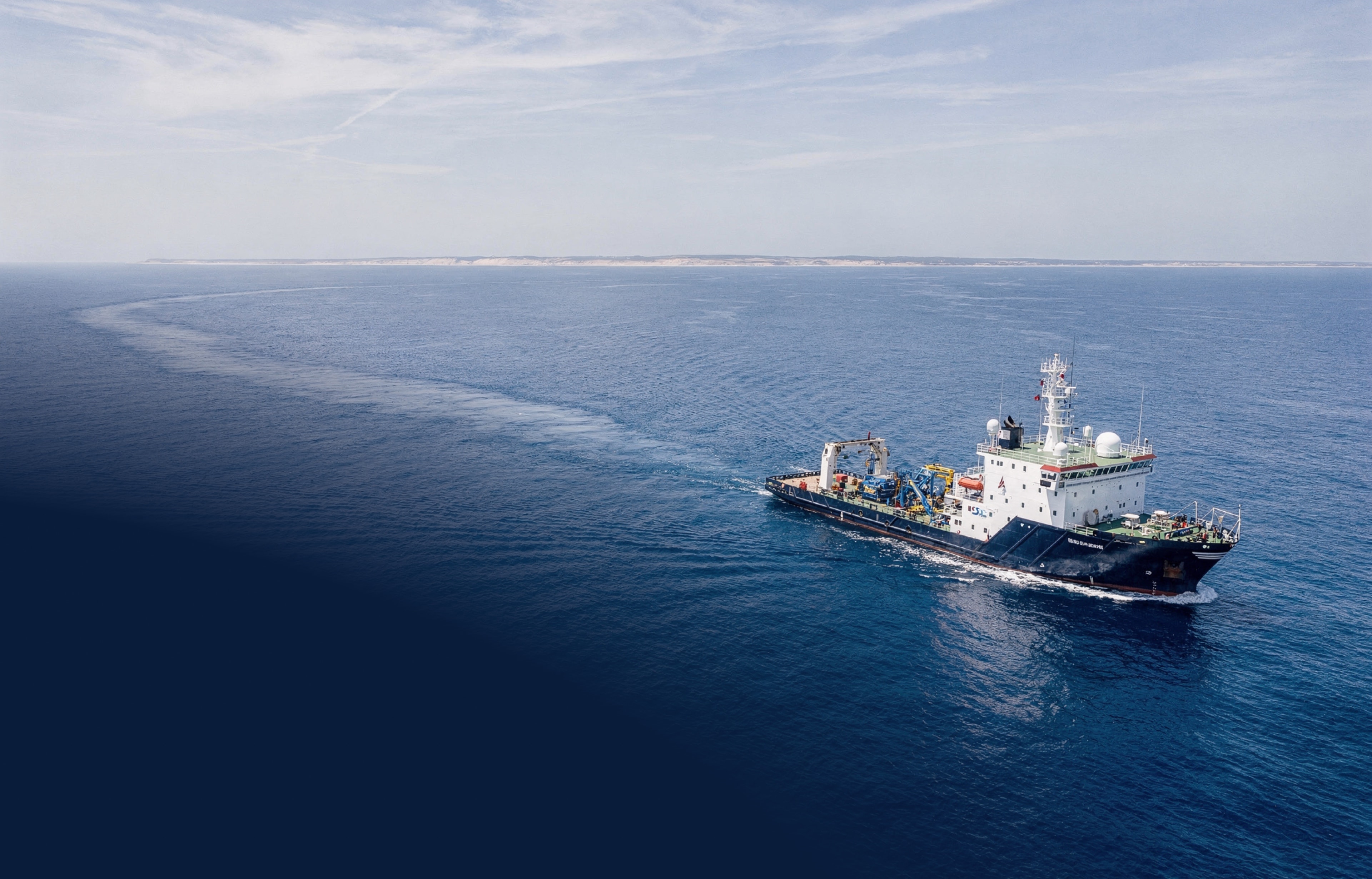 Offshore survey vessel cruising on deep blue Atlantic water off the Ghanaian coast